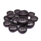 A pile of round, dark brown Luxury Suit Buttons with four holes is displayed on a white background.