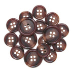 A scattered pile of brown, four-hole Luxury Suit Buttons is displayed on a white background.