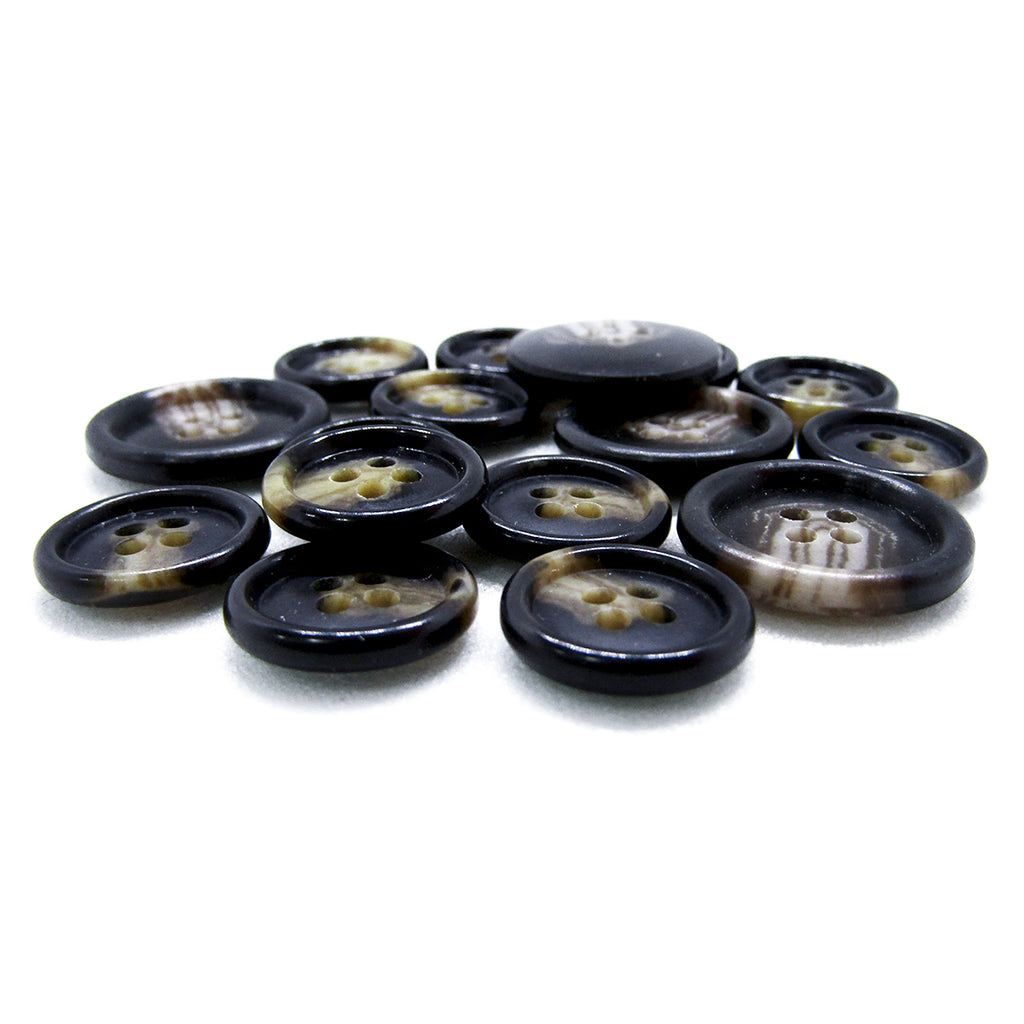 A pile of Premium Suit Buttons, round with four holes and a black and brown marbled design, displayed on a white background.