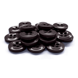 A pile of Work Shirt Buttons, dark and industrial with four holes, is arranged on a white surface.