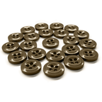 A 22 pack of brown, military spec work shirt buttons with four holes is arranged in a loose, curved pattern on a white background.