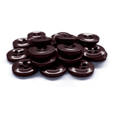 A pile of dark brown Work Shirt Buttons with four holes is arranged on a white background.