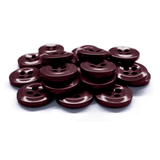 A pile of Work Shirt Buttons, dark brown with four holes, displayed on a white background.