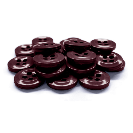 A pile of Work Shirt Buttons, dark brown with four holes, displayed on a white background.