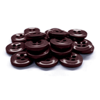 A stack of Work Shirt Buttons 12 Pack, featuring brown four-hole military spec buttons on a white background—ideal as durable replacement uniform buttons.
