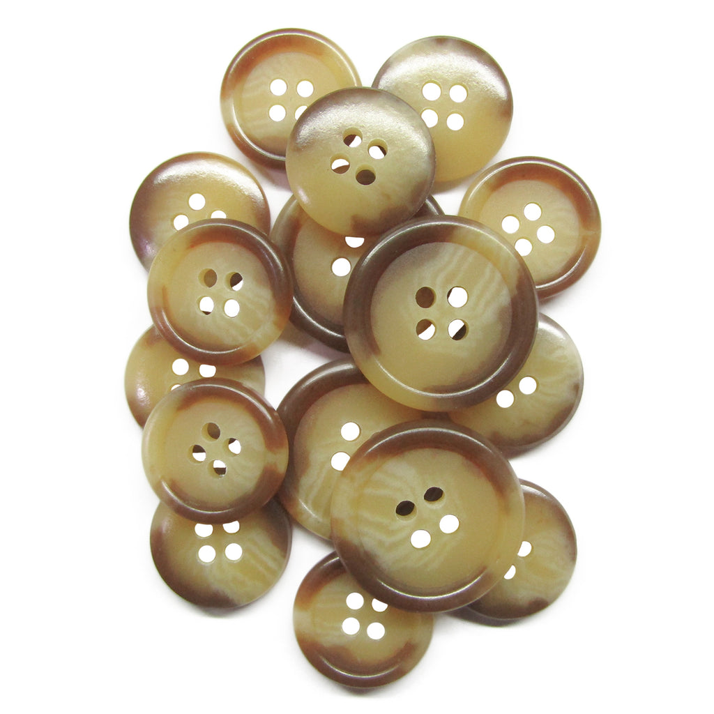 A set of brown and beige Vegan Faux Horn Suit Buttons on a white background, ideal for ethical sewing projects.