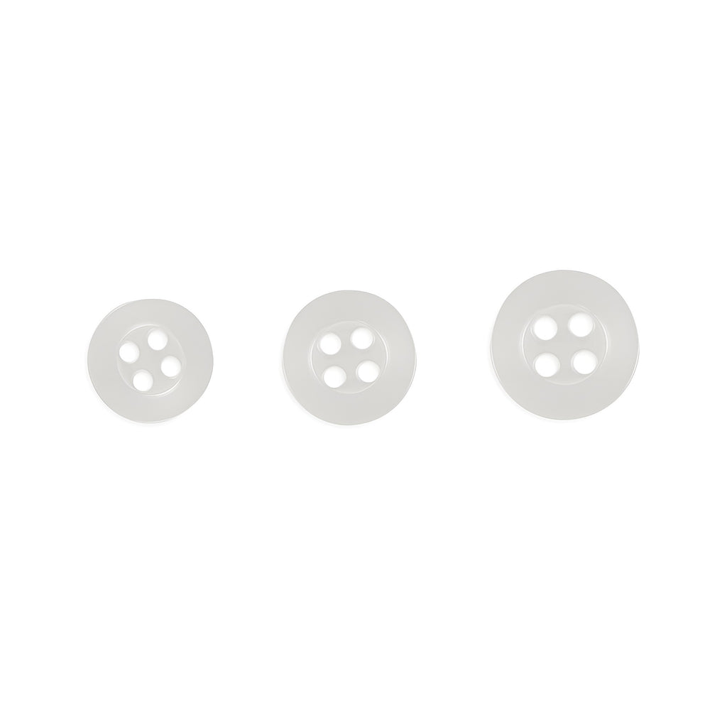 Three Replacement Shirt Buttons in matte poly-nylon, each a different size, are arranged in a row on a plain white background—ideal for any tailor's kit.