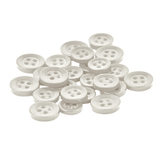 A pile of small, round, white Replacement Shirt Buttons scattered on a white background—perfect additions to any tailor's kit.