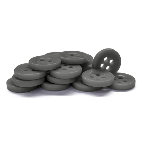 A stack of gray, round Workshop Uniform Shirt Buttons with four holes displayed on a white background.