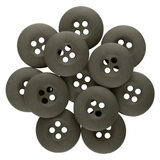 A pile of round, black Tactical Buttons with four holes overlaps each other on a white background.