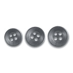 Three matte gray replacement shirt buttons in varying sizes, each round with four holes, are arranged in a row on a white background.