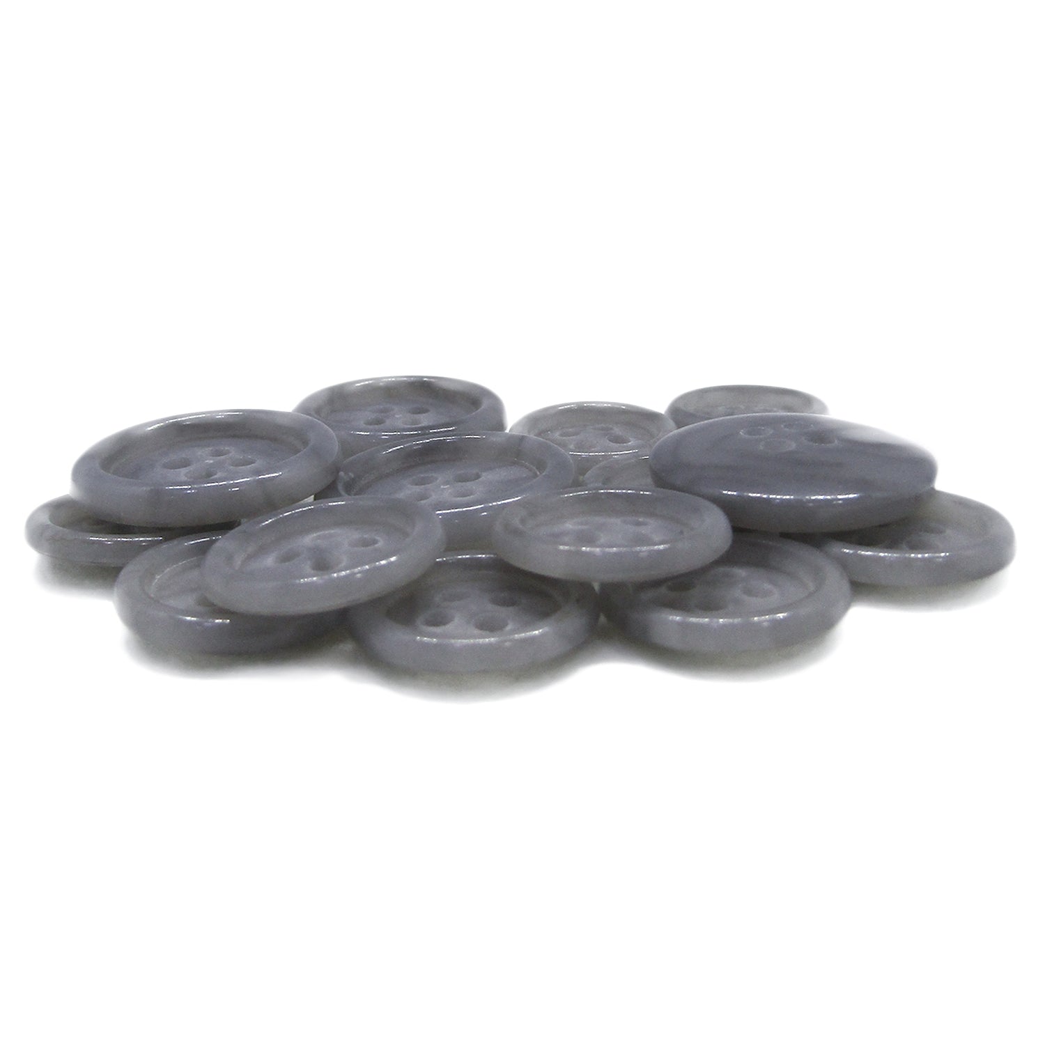 Luxury Suit Buttons—gray, round, four-hole style—are scattered on a white surface.