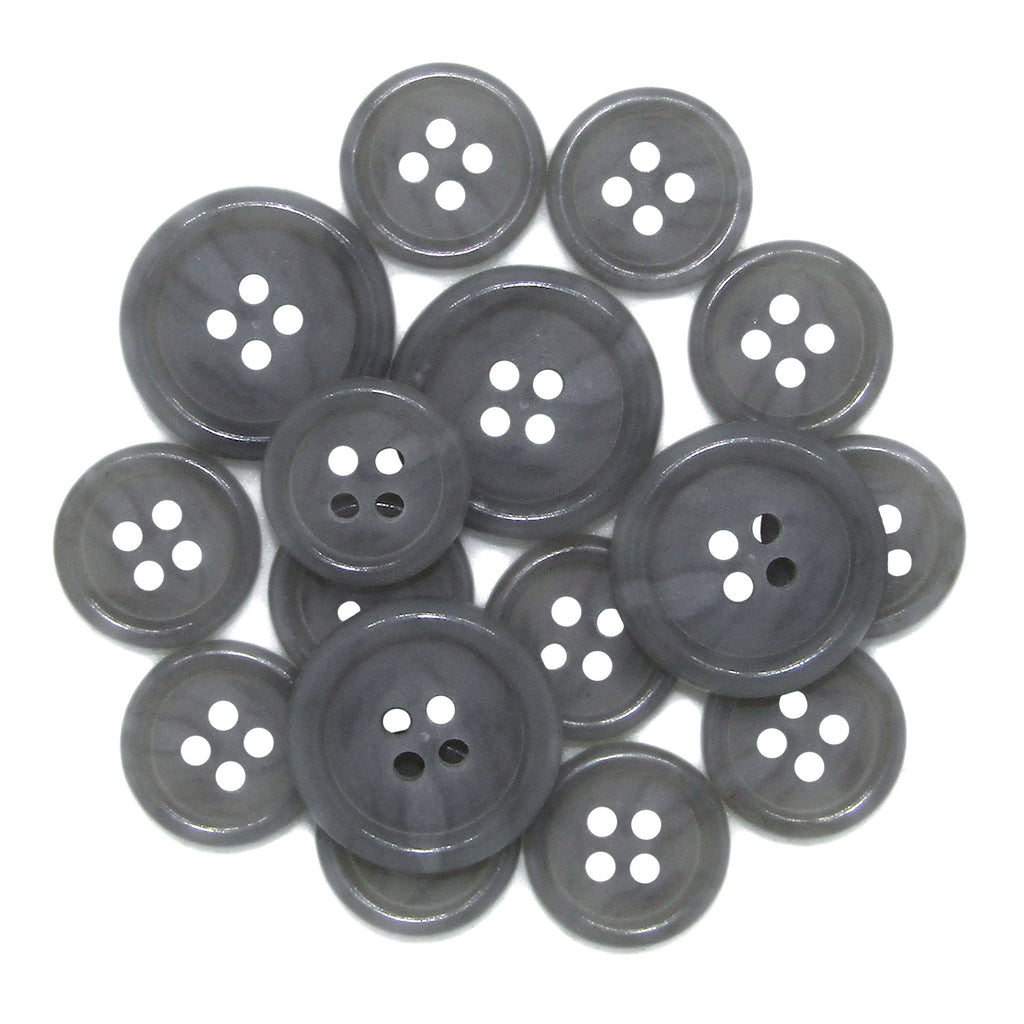 A collection of Luxury Suit Buttons in assorted gray shades, each with four holes, are overlapping on a white background.