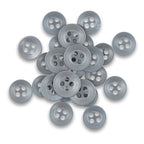 A pile of Replacement Shirt Buttons—gray, four-hole poly-nylon with a matte finish—scattered on a white background, ideal for any tailor's button kit.