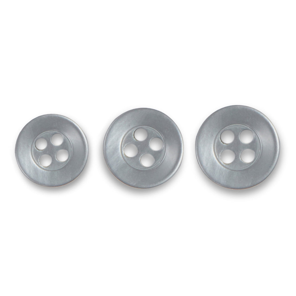 Three round, silver Replacement Shirt Buttons made of poly-nylon with a matte finish and four holes are arranged in a row by increasing size.