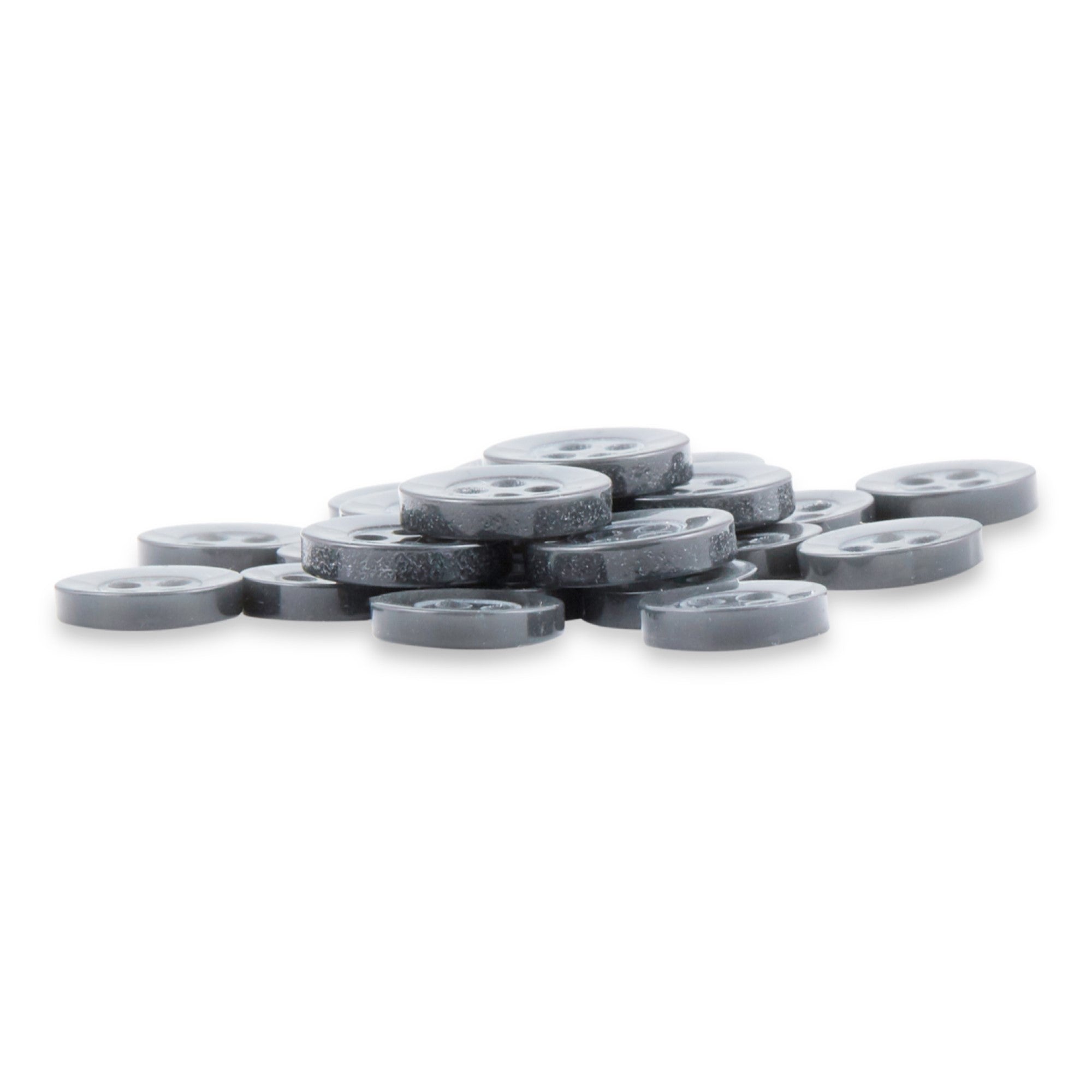 A stack of Replacement Shirt Buttons—small, round, flat gray poly-nylon buttons with a matte finish and four holes each—lies on a white surface.