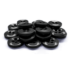 A stack of black, four-hole Work Shirt Buttons 22 Pack is arranged together on a white background.