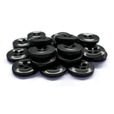 Work Shirt Buttons in black are scattered and stacked on a white surface.