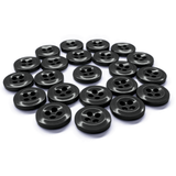 Twenty black Work Shirt Buttons, each with four holes, are displayed in a loose, slightly curved arrangement on a white background.