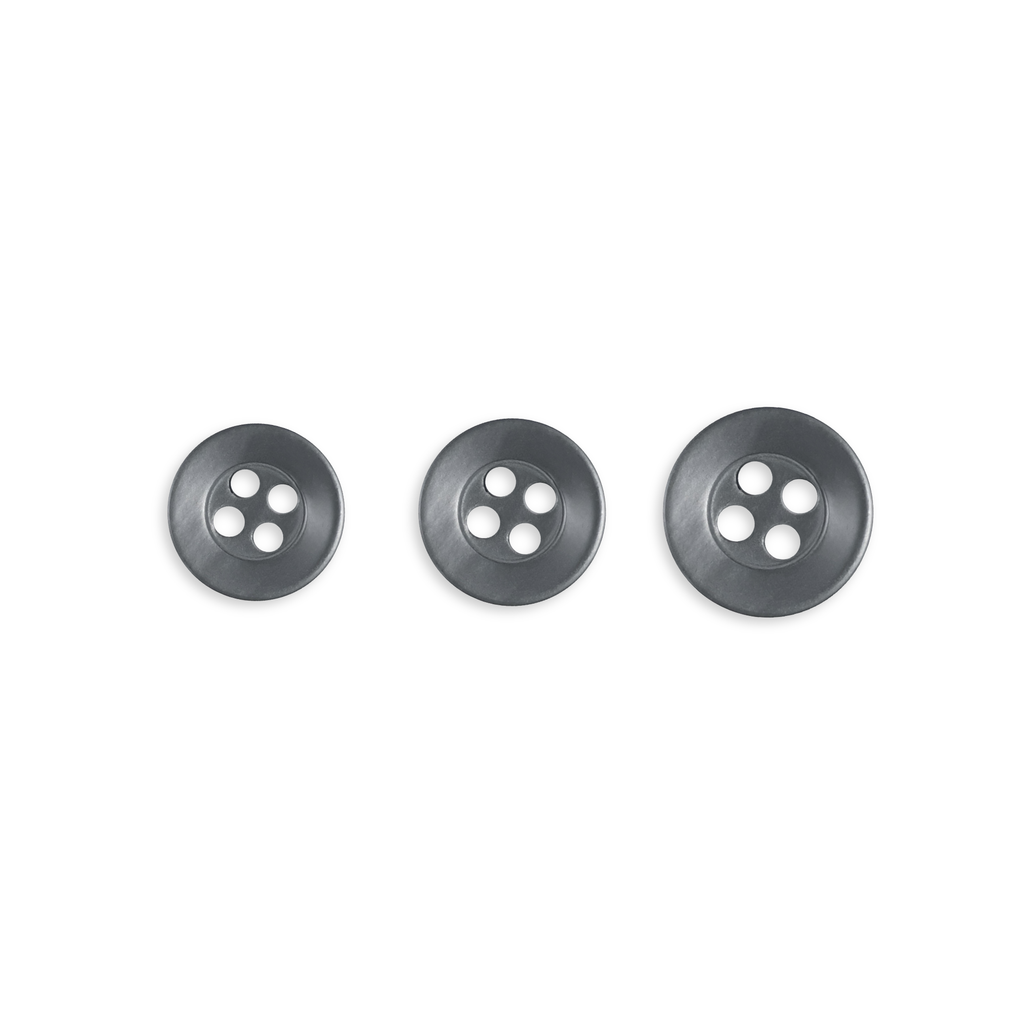 Three Replacement Shirt Buttons of increasing size, ideal for a tailor's kit, are neatly arranged in a row on a white background.