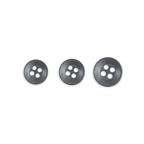 Three Replacement Shirt Buttons of increasing size, ideal for a tailor's kit, are neatly arranged in a row on a white background.