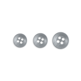Three Replacement Shirt Buttons in silver poly-nylon, each with four holes and different sizes, arranged in a row on a white background—durable and ideal for any tailor’s kit.