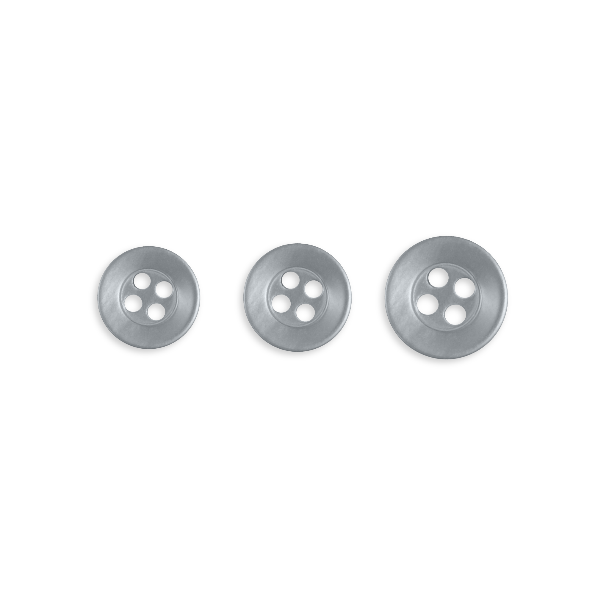 Three Replacement Shirt Buttons in silver poly-nylon, each with four holes and different sizes, arranged in a row on a white background—durable and ideal for any tailor’s kit.