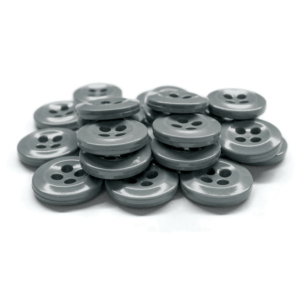 A stack of gray, four-hole Work Shirt Buttons from a 12 Pack displayed on a white surface.