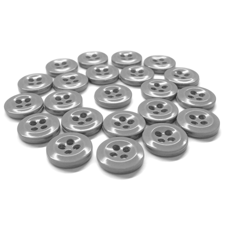 A set of shiny gray Work Shirt Buttons, made to military specifications, arranged in a loose circle on a white background.