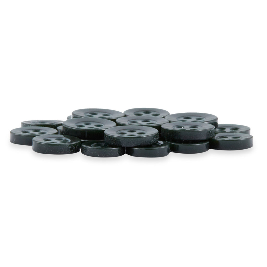 A stack of black, round Replacement Shirt Buttons with a matte finish and four holes, slightly overlapping—ideal for any tailor’s kit.