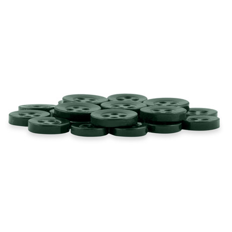 A pile of Replacement Shirt Buttons in dark green, round, four-hole poly-nylon, displayed on a white background—an ideal addition to any tailor's kit.