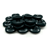 A pile of black, round Work Shirt Buttons with four holes, meeting military specs, displayed on a white background.