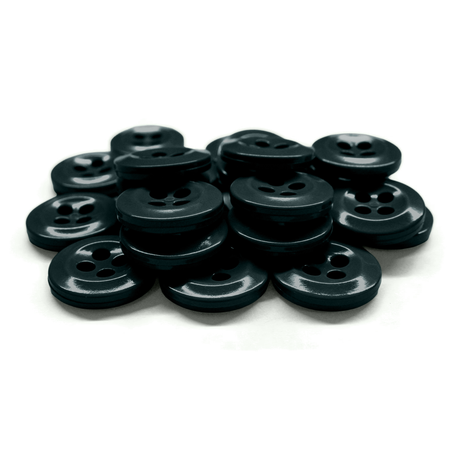 A pile of black, round Work Shirt Buttons with four holes, meeting military specs, displayed on a white background.