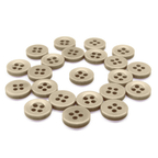A set of beige Workshop Uniform Shirt Buttons with four holes, displayed on a white background.