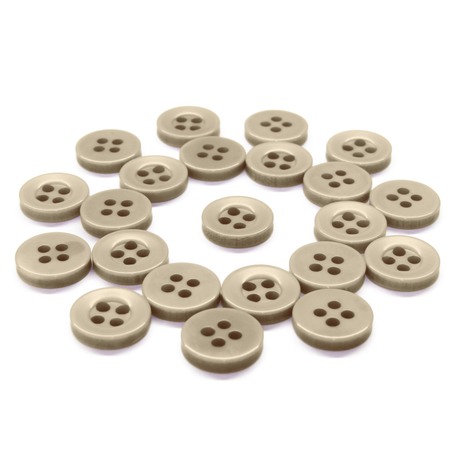 A set of beige Workshop Uniform Shirt Buttons with four holes, displayed on a white background.