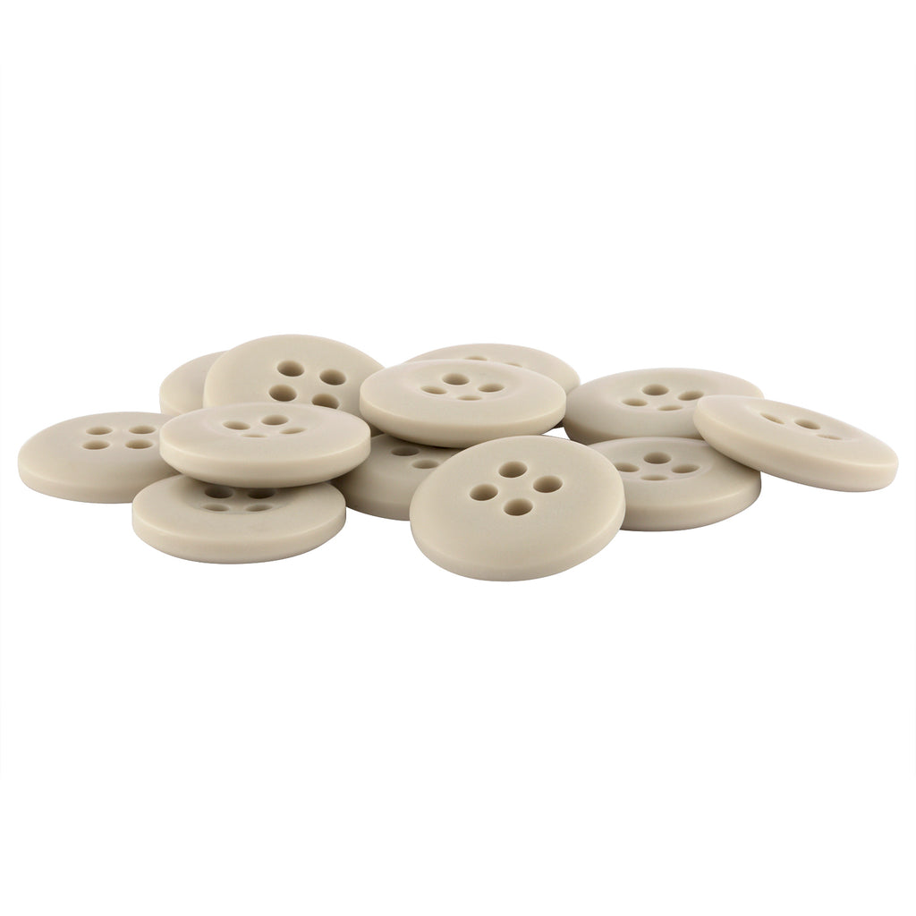 A pile of round, beige Khakis, Chinos and Casual Cotton Pant Buttons made of nylon with four holes on a white background.