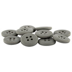 A pile of round, flat Khakis, Chinos and Casual Cotton Pant Buttons in gray nylon with four holes each, overlapping on a white background.
