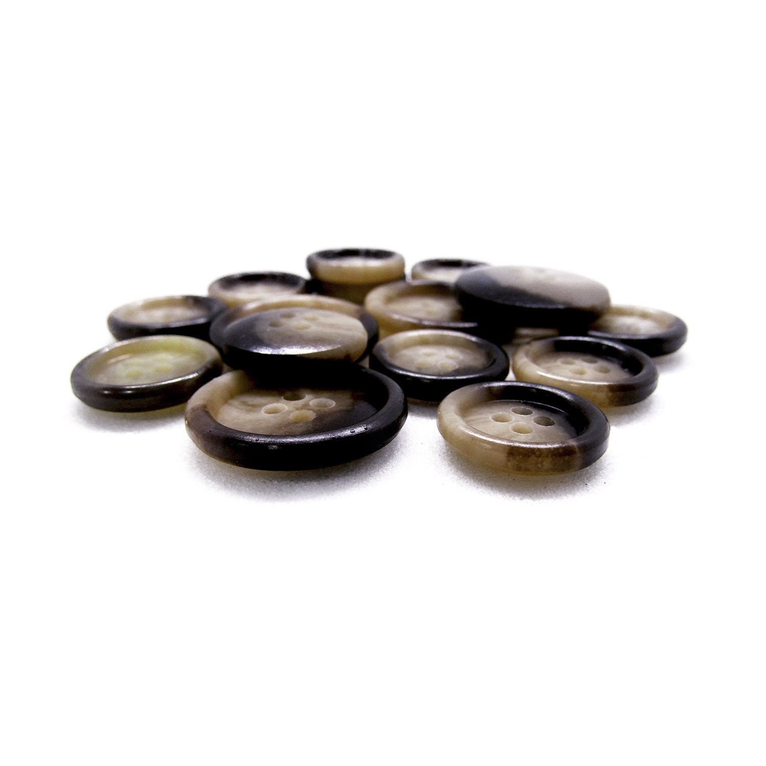 Premium Suit Buttons in brown, beige, and black—ideal for suits and blazers—are scattered on a white surface.