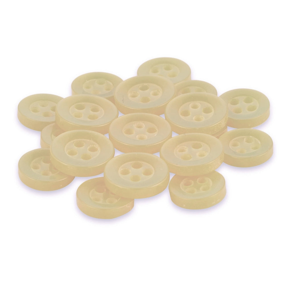 A pile of Replacement Shirt Buttons, light yellow with four holes and a matte poly-nylon finish, is arranged on a white background.