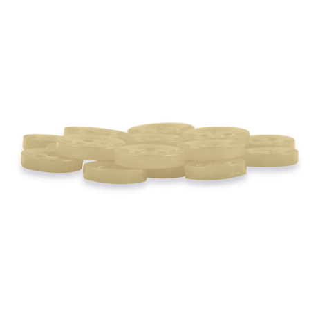 A pile of Replacement Shirt Buttons—small, round, light beige with four holes each—is neatly arranged on a white surface.