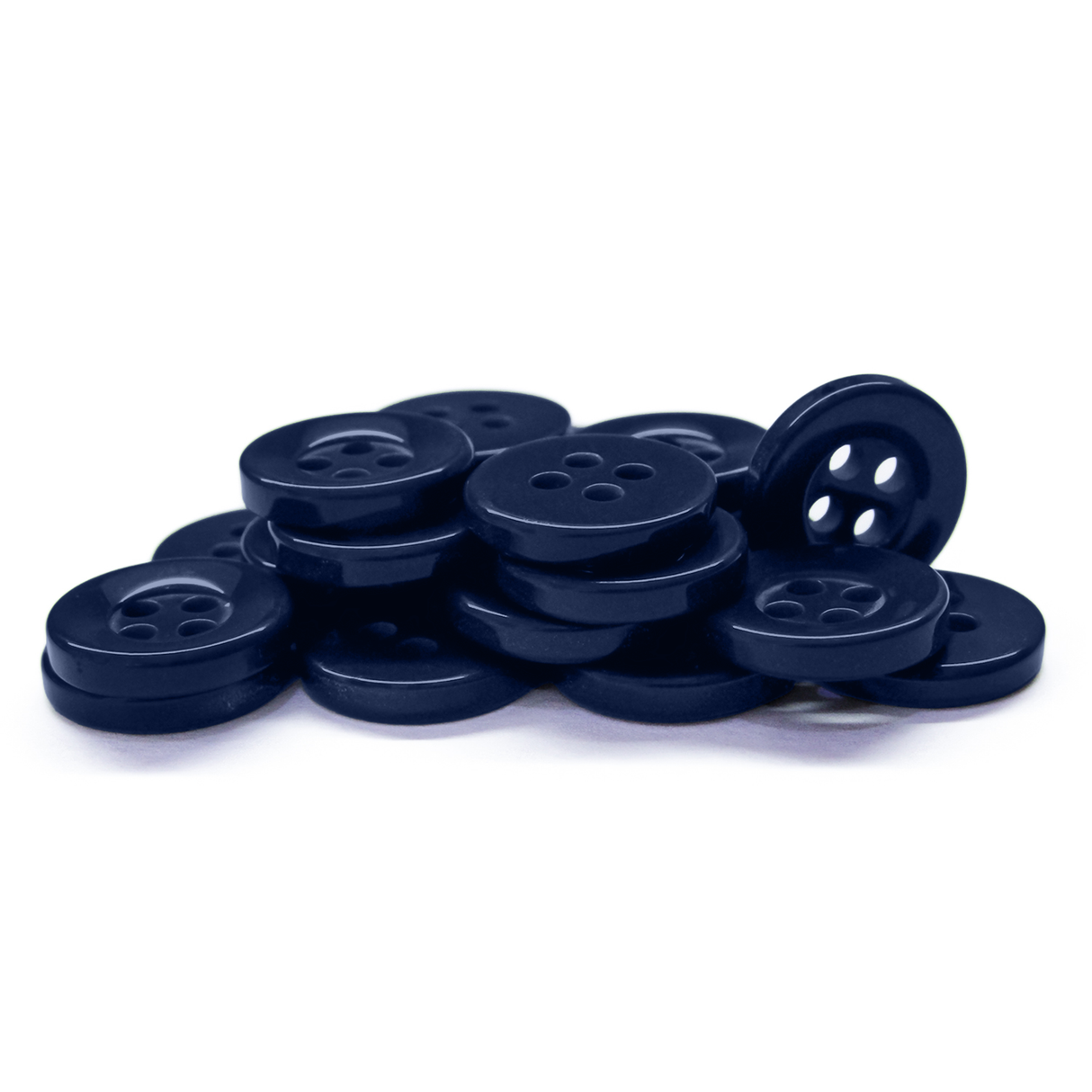 A pile of Workshop Uniform Shirt Buttons in durable navy, each with four holes, is stacked on a white background.