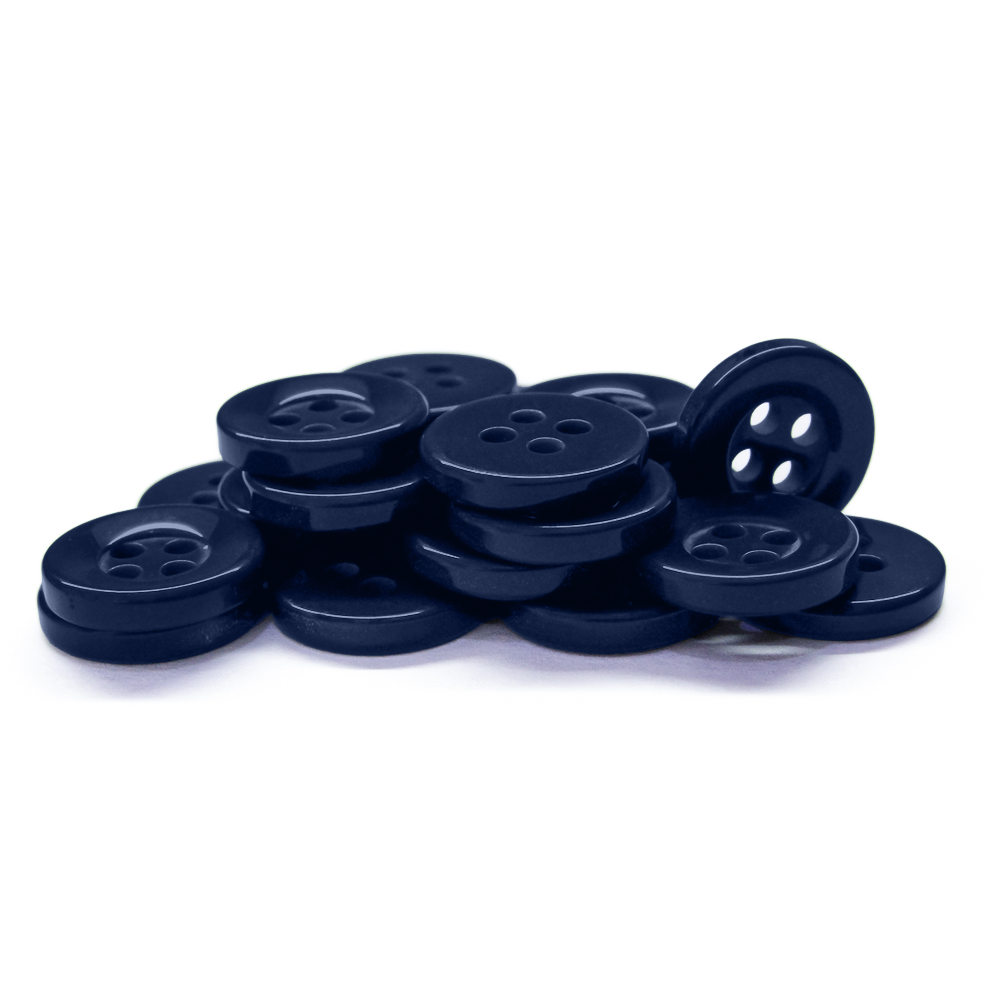 A pile of Workshop Uniform Shirt Buttons in durable navy, each with four holes, is stacked on a white background.