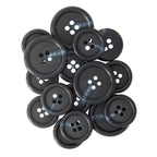 A collection of Vegan Faux Horn Suit Buttons, black with four holes each, displayed on a white background.