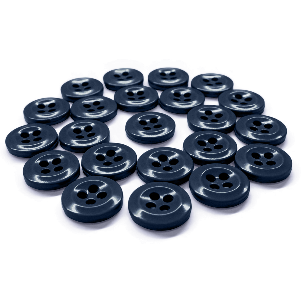 A set of Work Shirt Buttons 22 Pack in dark blue, arranged neatly in a curved pattern on a white surface.