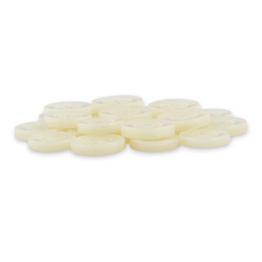 A pile of Replacement Shirt Buttons, round, white, and flat with a matte finish like buttons, is arranged on a white surface.