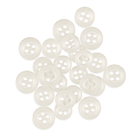 A pile of small, round, white Replacement Shirt Buttons from a tailor’s kit is scattered on a white background.