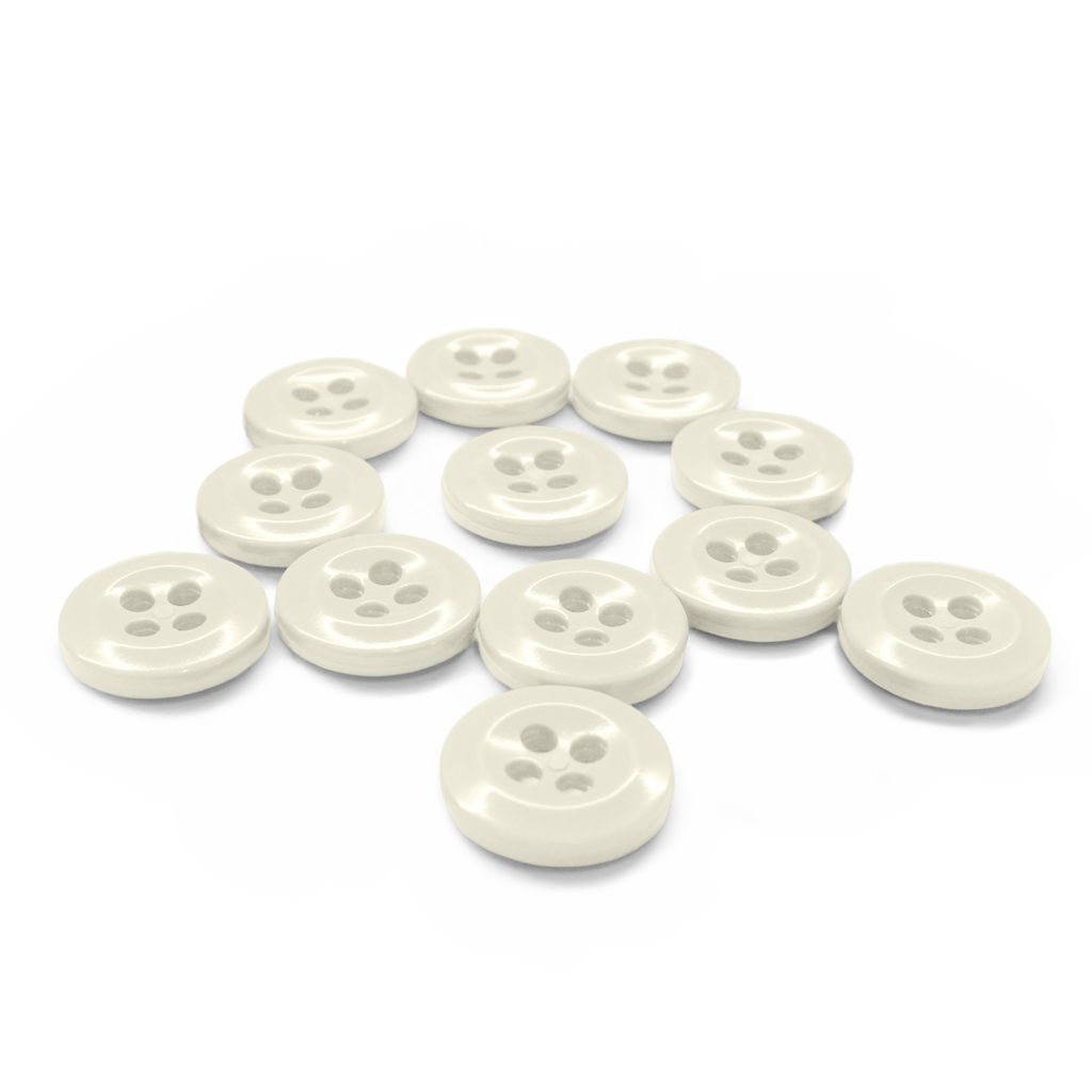 The Work Shirt Buttons 12 Pack features twelve white, four-hole buttons arranged in a scattered pattern on a white background.
