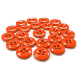 Twenty Work Shirt Buttons in orange, each with four holes and military specs, are arranged in a semi-circle on a white background.