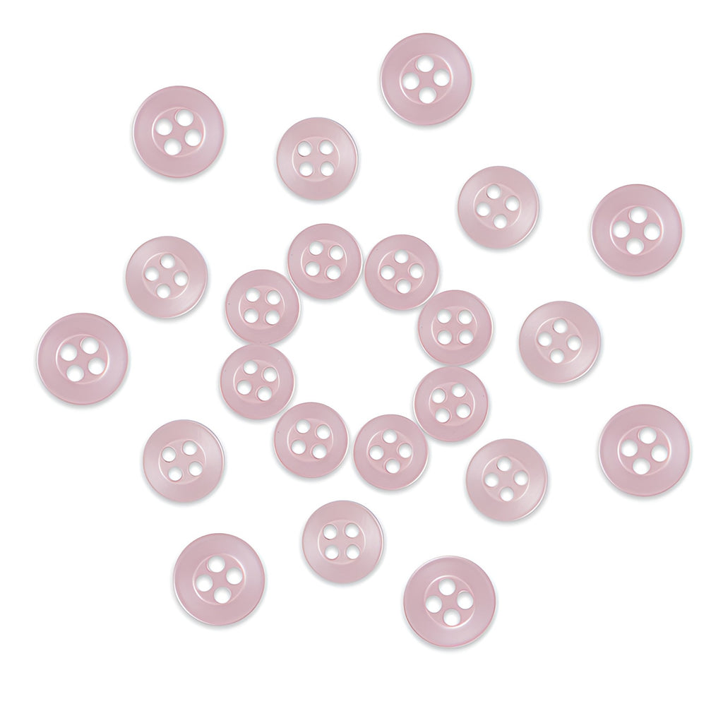 Twenty-four Replacement Shirt Buttons in light pink with a matte finish and four holes are arranged in a loose circle on a white background—an ideal addition to any tailor’s button kit.