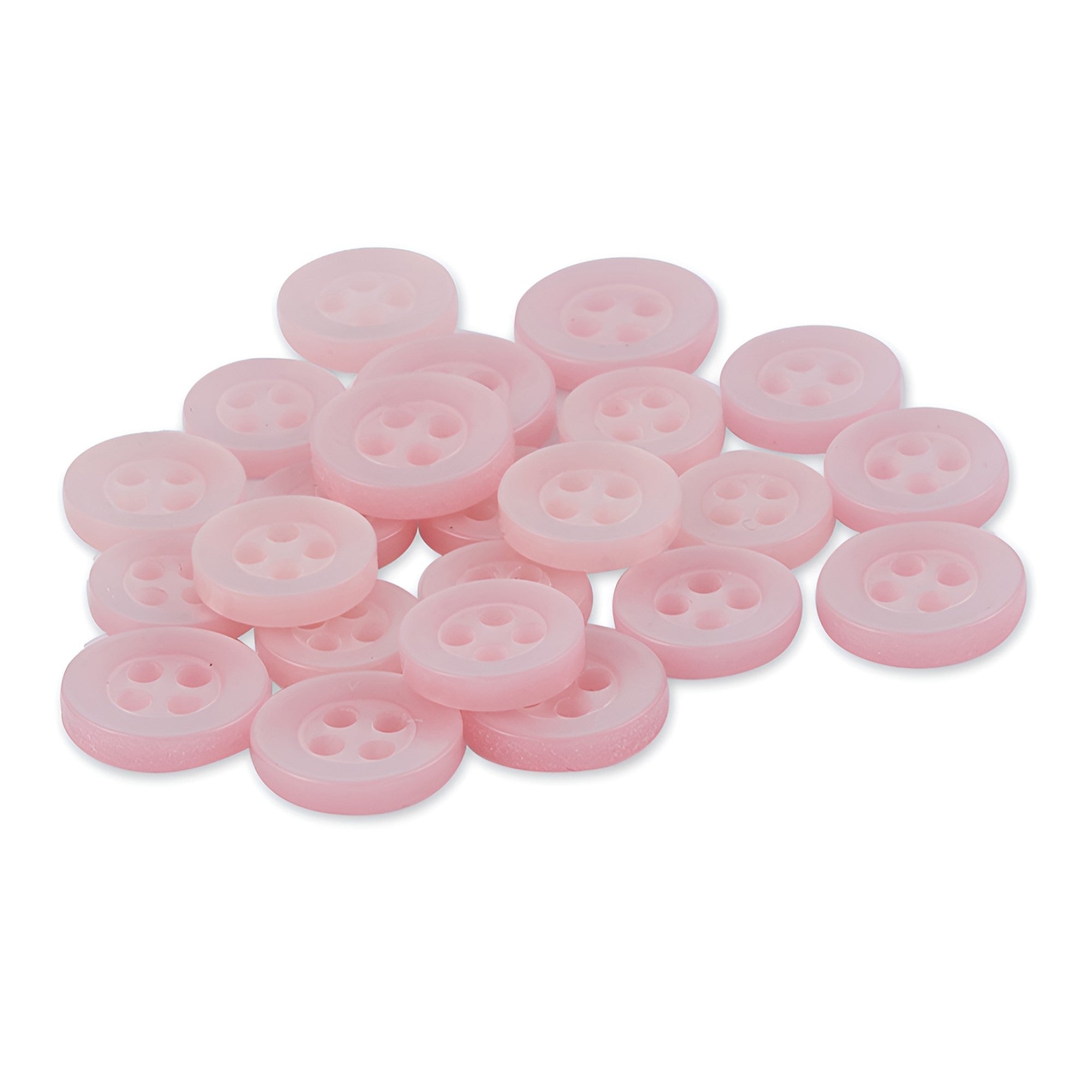 A pile of Replacement Shirt Buttons—small, round, light pink poly-nylon with a matte finish and four holes—arranged on a white background.